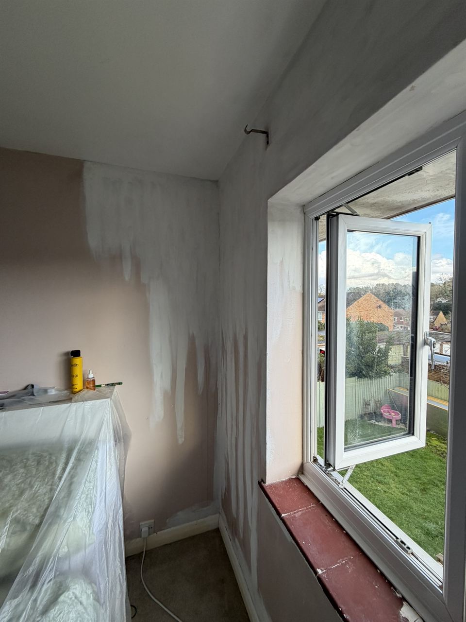 Bedroom ceiling and window reveal after mould treatment